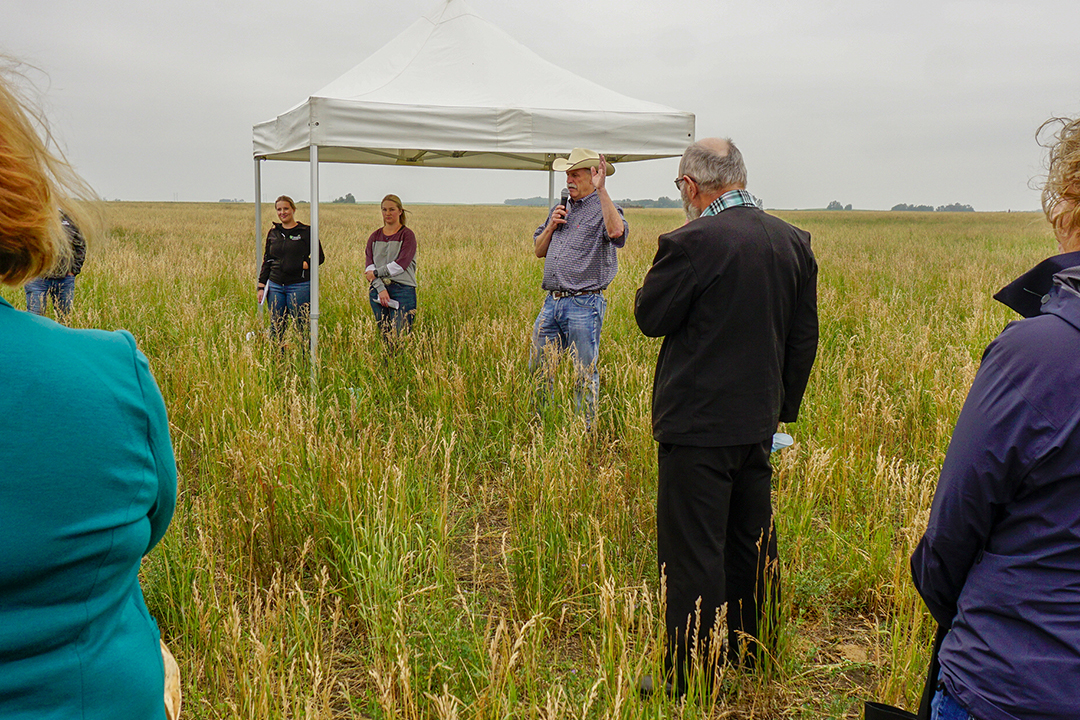Animal scientist Dr. Bart Lardner (PhD) with graduate students Cassidy Sim and Megan Wasden share preliminary findings of their research at the LFCE summer field day presented by Canadian Western Agribition. Photo: Gord Waldner